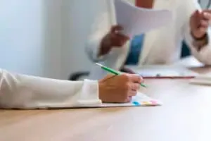 side view hand holding pencil